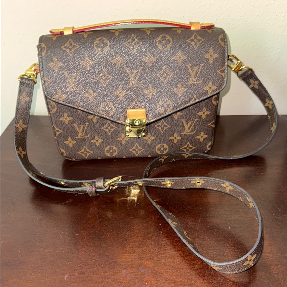 Like a Louis Vuitton Brown Monogram Crossbody Bag with Gold Hardware